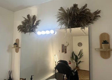 Elegant interior of BABE Aesthetics, Billingham, England, GB, featuring chic decor and a plush treatment chair.