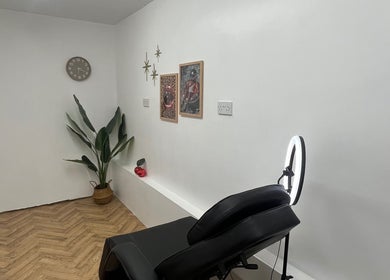 Modern treatment room at BABE Aesthetics in Billingham, England, GB, featuring stylish decor and comfortable seating.