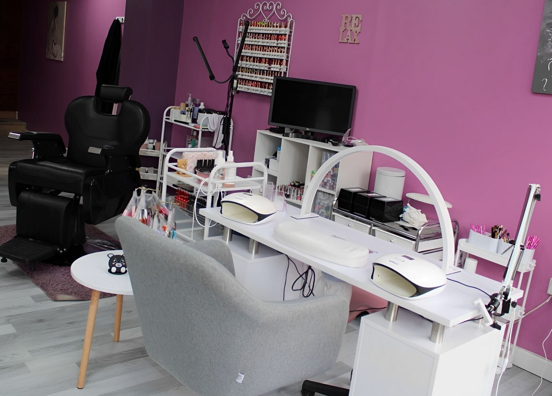 GlamMary beauty salon interior with chic purple walls in Wallsend, England, GB.