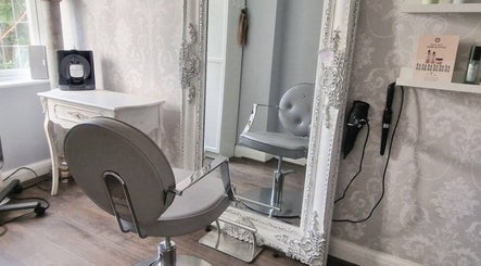 Chic salon chair and ornate mirror at Scarlett Valentine Hair in Epsom, England, GB.