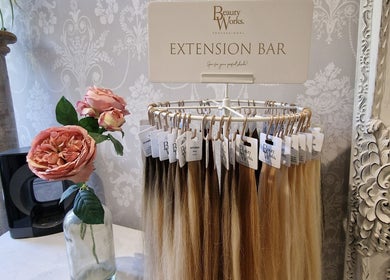 Hair extension bar at Scarlett Valentine Hair, Epsom, England, GB with roses and ornate decor.