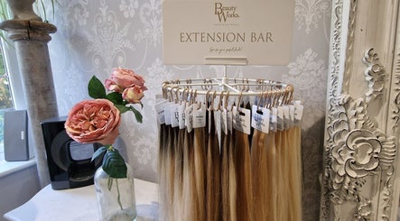 Hair extension bar at Scarlett Valentine Hair, Epsom, England, GB with roses and ornate decor.
