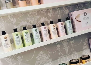 Hair care products on elegant shelves at Scarlett Valentine Hair, Epsom, England, GB.