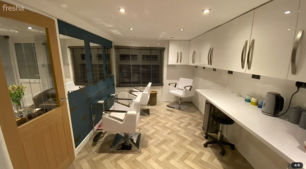 Modern styling chairs and sleek workspace at Azure Hair and Beauty, Hixon, England, GB.