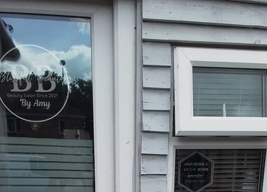 Blissful Beauty salon entrance in Taunton, England with stylish signage alongside window.