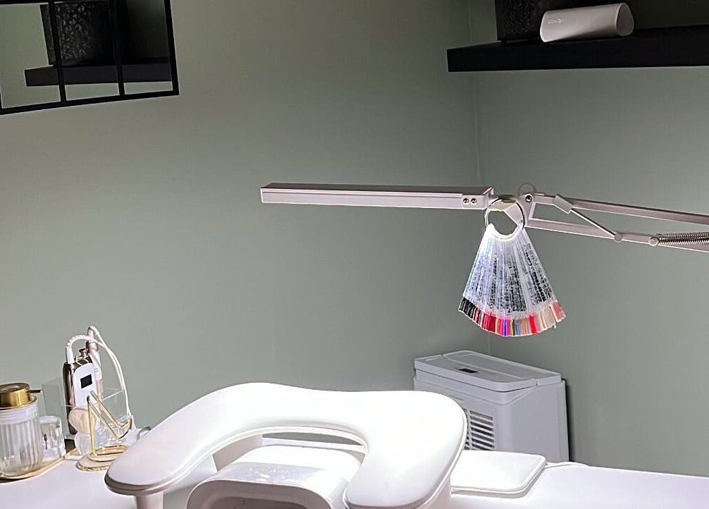 Modern nail station at Nails by Cat, Cambuslang, Scotland, GB, showcasing tools and polish samples.