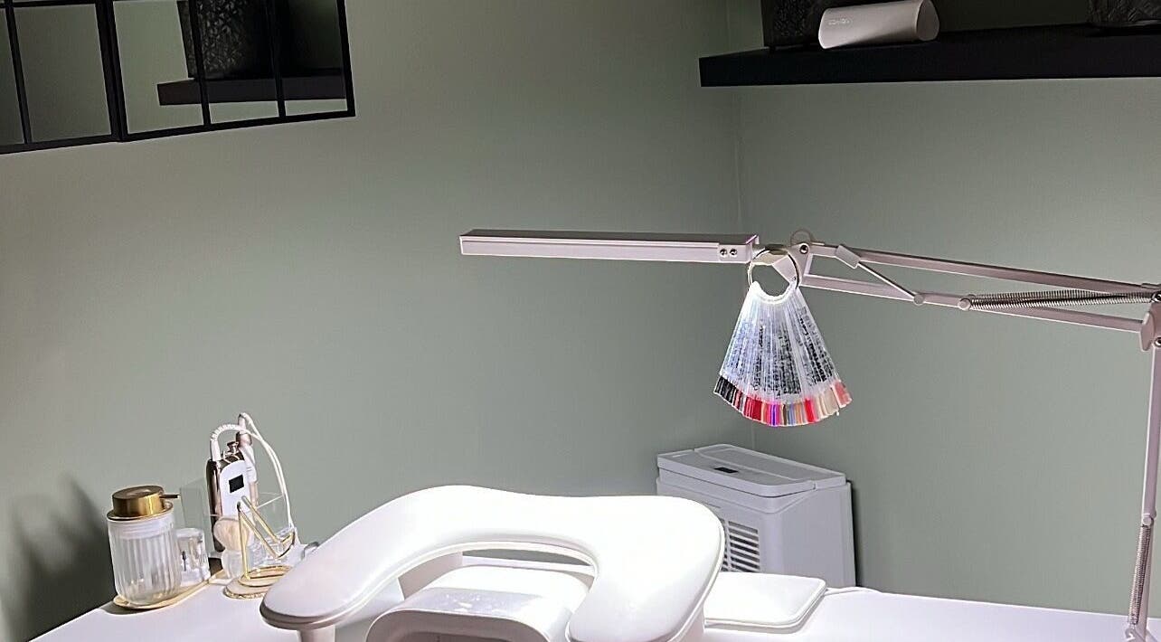 Modern nail station at Nails by Cat, Cambuslang, Scotland, GB, showcasing tools and polish samples.