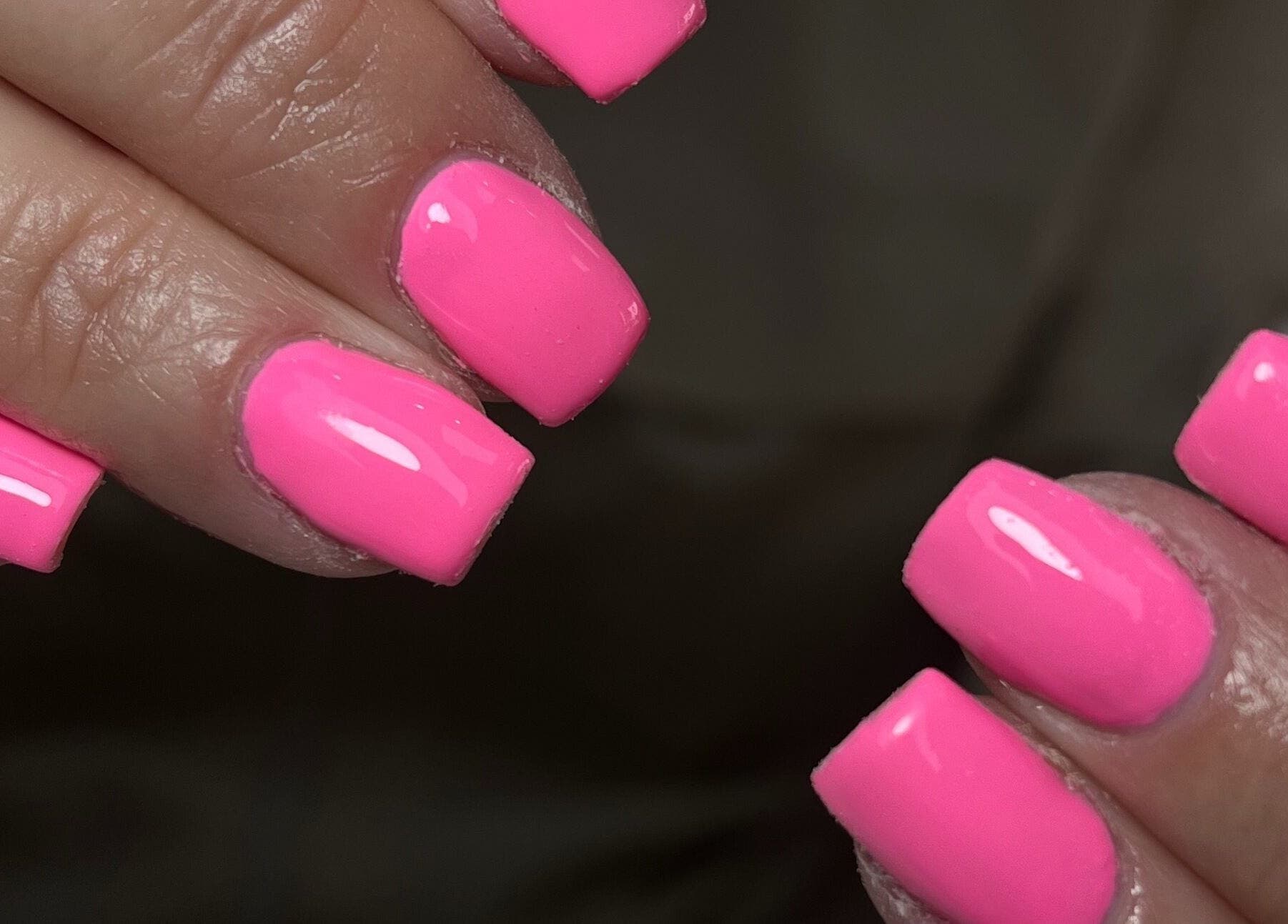 Vibrant pink nails by Nails by Cat located in Cambuslang, Scotland, GB, showcasing expert nail art.