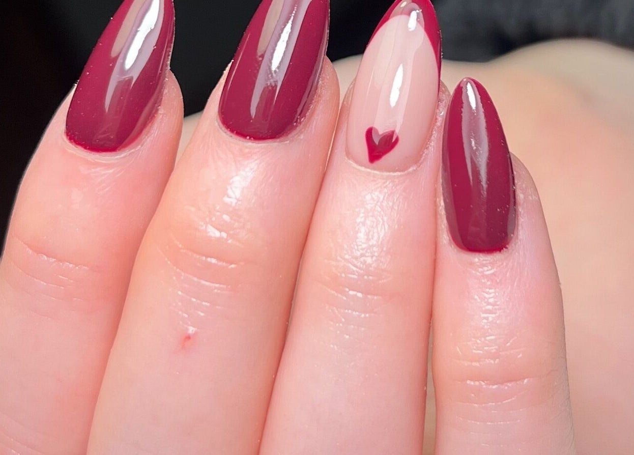 Elegant red manicure with heart design by Nails by Cat in Cambuslang, Scotland, GB.