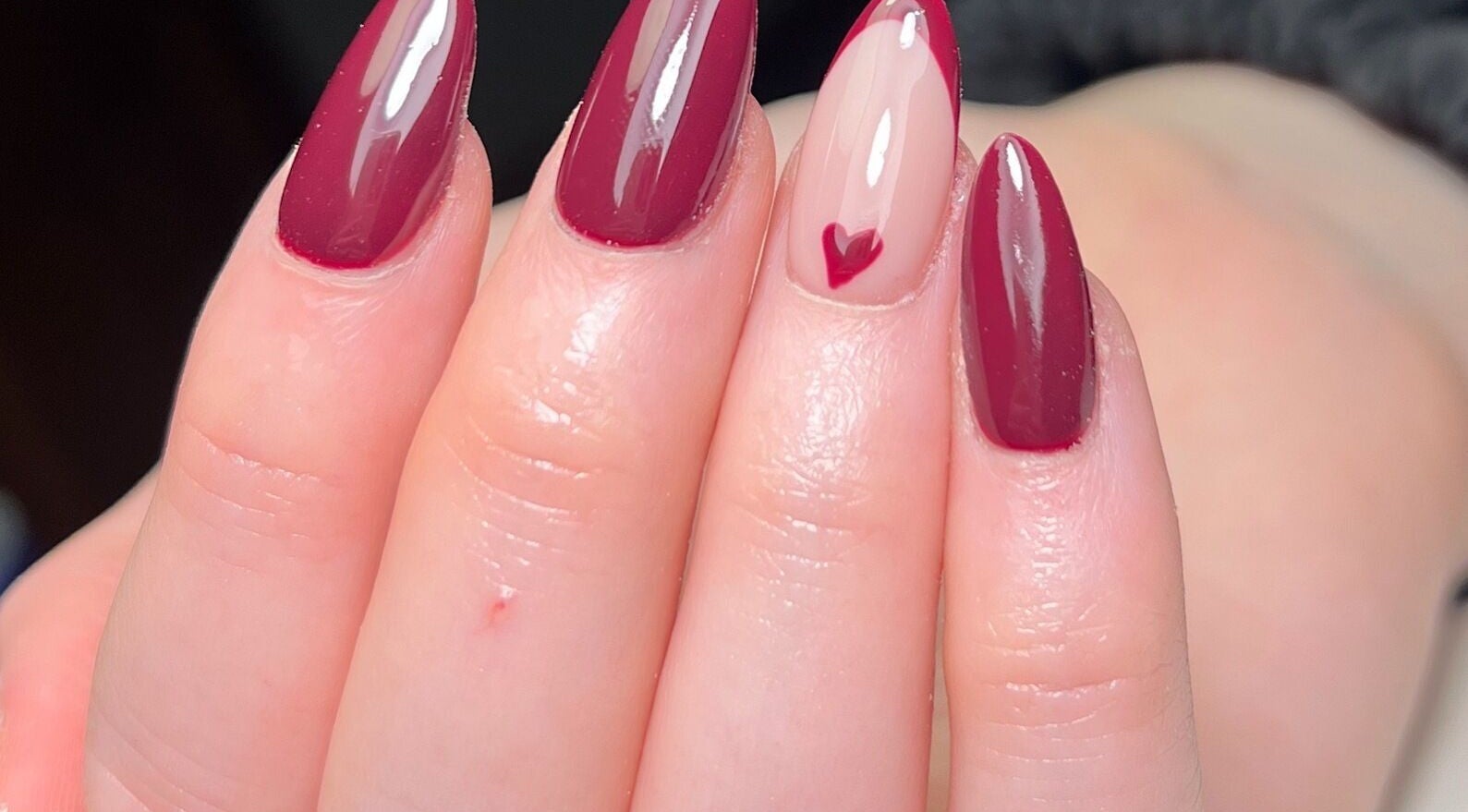 Elegant red manicure with heart design by Nails by Cat in Cambuslang, Scotland, GB.
