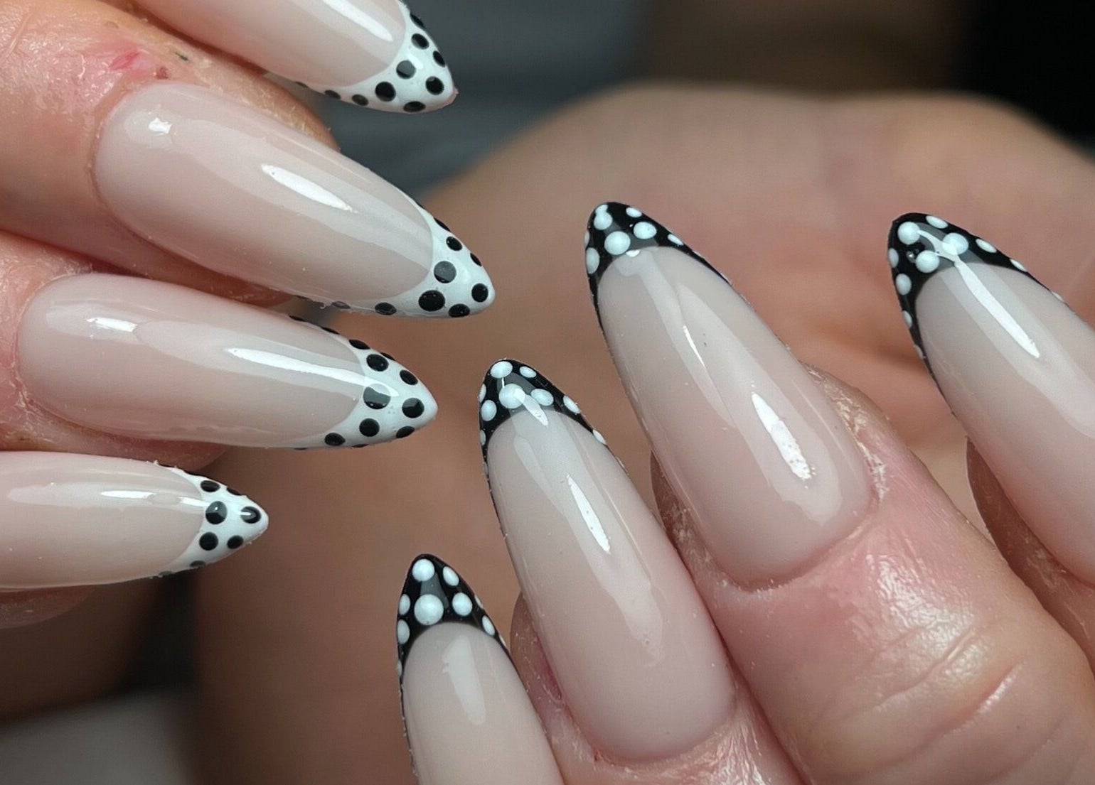 Polka dot nail art at Nails by Cat in Cambuslang, Scotland, GB showcasing chic black and white designs.