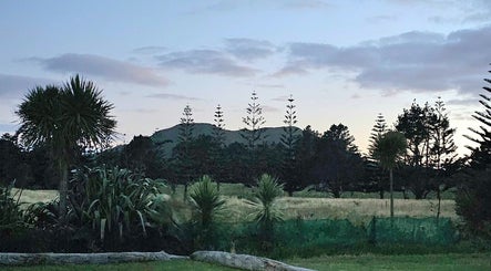 Serene twilight view of natural landscape at Wai Ora Spa Therapies, Pukenui, Northland Region, NZ.