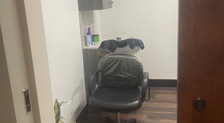 Intimate salon space at Thee Hair Slayer, Sandy Springs, Georgia, with a styling chair and sink.