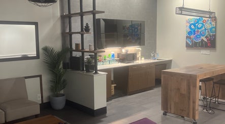 Modern salon interior at Thee Hair Slayer, Sandy Springs, Georgia, US with chic decor and seating area.