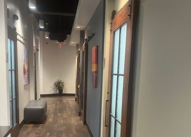 Elegant interior corridor of Thee Hair Slayer in Sandy Springs, Georgia, US showcases modern design and lighting.