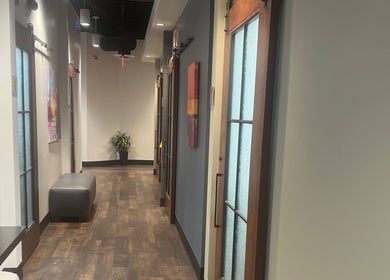 Stylish hallway at Thee Hair Slayer, Sandy Springs, Georgia, US with modern doors and elegant decor.