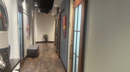 Stylish hallway at Thee Hair Slayer, Sandy Springs, Georgia, US with modern doors and elegant decor.
