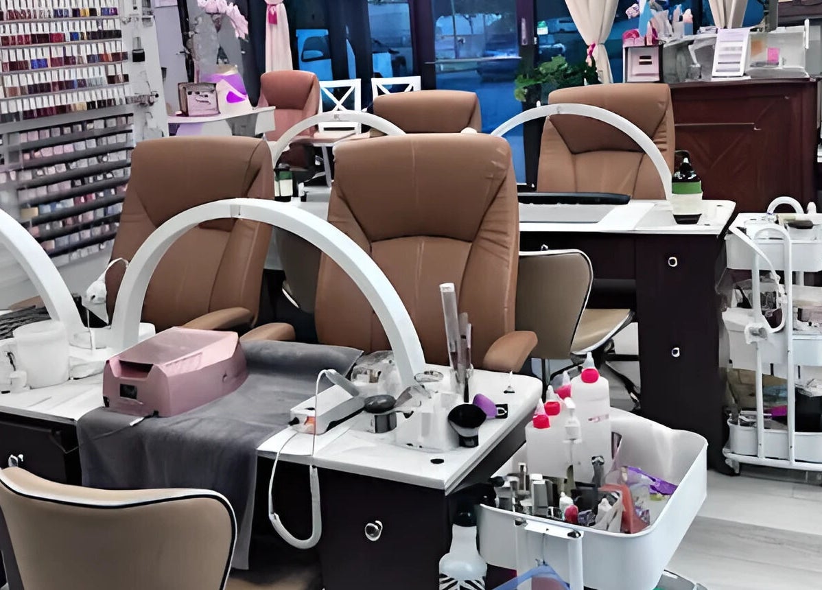 Modern nail station at Scarlett's Salon Spa & Nails, Austin, Texas, US showcasing elegant seating and manicure tools.
