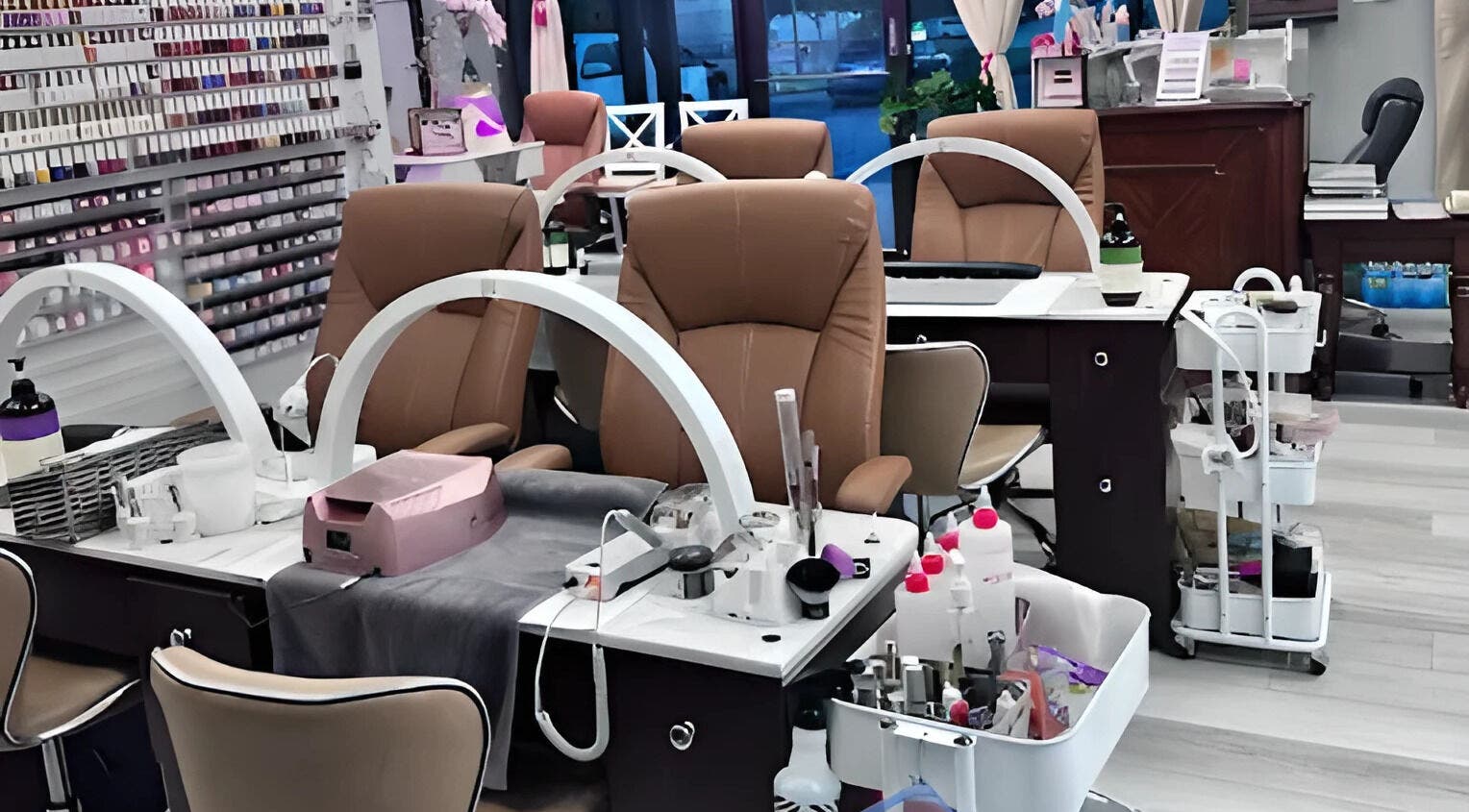 Modern nail station at Scarlett's Salon Spa & Nails, Austin, Texas, US showcasing elegant seating and manicure tools.
