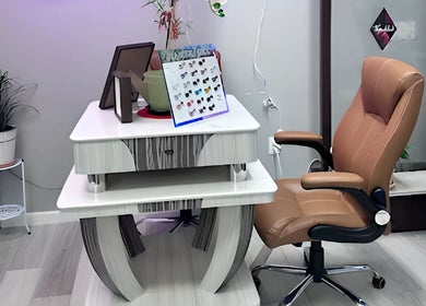 Elegant nail station at Scarlett's Salon Spa & Nails in Austin, Texas, US, featuring a luxurious chair and stylish decor.