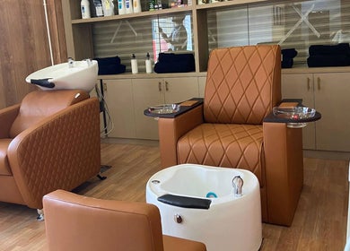 Relaxing pedicure chairs at Glam Studios Belathur, Bengaluru, Karnataka, IN offering premium wellness services.