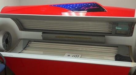 Red tanning bed at Firehouse Fitness, Ottawa, Ohio, US for optimal indoor tanning experiences.