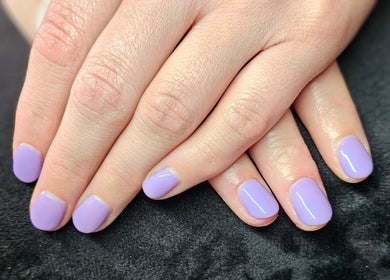 Lavender manicured nails at Elysian Beauty, Winton, Southland Region, NZ, showcasing elegance and style.