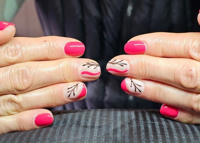 Elegant nail art at Elysian Beauty, Winton, Southland Region, NZ, featuring pink and artful designs.