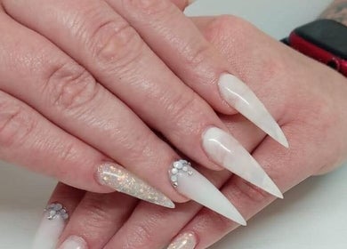 Elegant white acrylic nails with rhinestones at STYLETTE'S, George, Western Cape, ZA. Perfect manicure design.