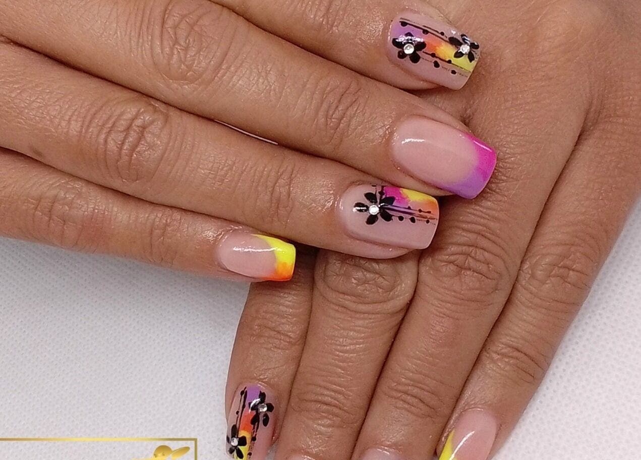 Colorful nail art with floral designs at Stylette's, Gqeberha, Eastern Cape, ZA.