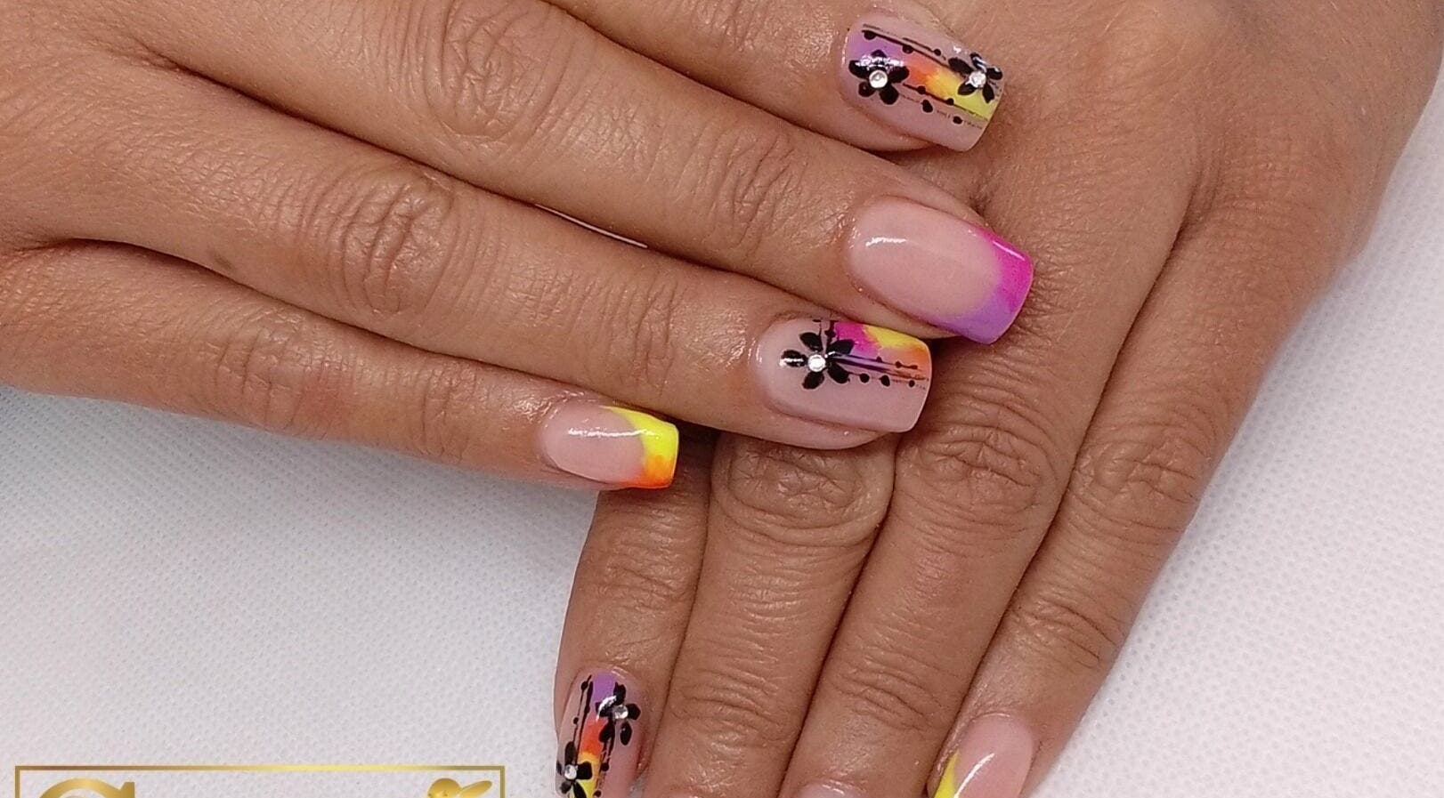 Colorful nail art with floral designs at Stylette's, Gqeberha, Eastern Cape, ZA.