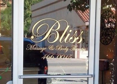 Charming entrance of 805 Skin Plug Esthetics in Atascadero, California, US with elegant glass door display.