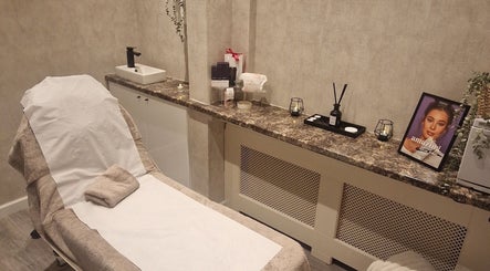 Relaxing treatment room at Beauty by Jade, Wallington, England, GB featuring a comfortable spa bed.