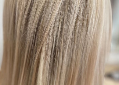 Close-up of sleek blonde hair at The Bleach Theory, Currumbin Waters, Queensland, AU.