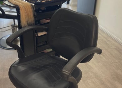 Comfortable salon chair at The Bleach Theory, Currumbin Waters, Queensland, AU, ready for a hair transformation.