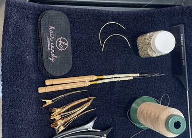 Hair styling tools at The Bleach Theory, Currumbin Waters, Queensland, AU, showcasing clips, comb, and thread.