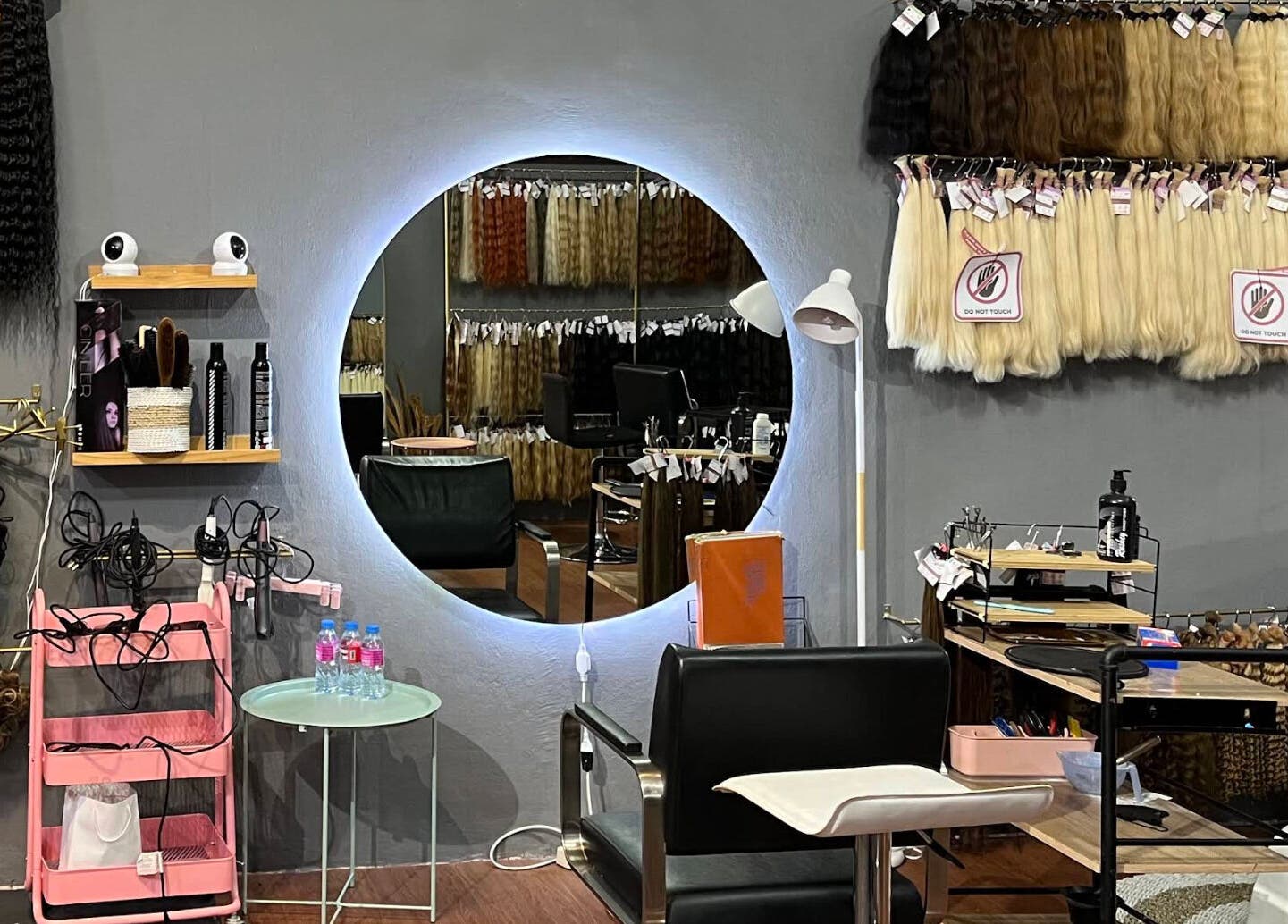 Modern salon interior at The Hair, Bali, Bali, ID, featuring hair extensions and styling tools.