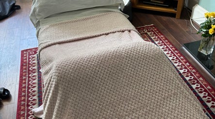 Relaxing massage bed at Sapphire Soul Alchemy in GB, offering serene calmness and wellness experiences.