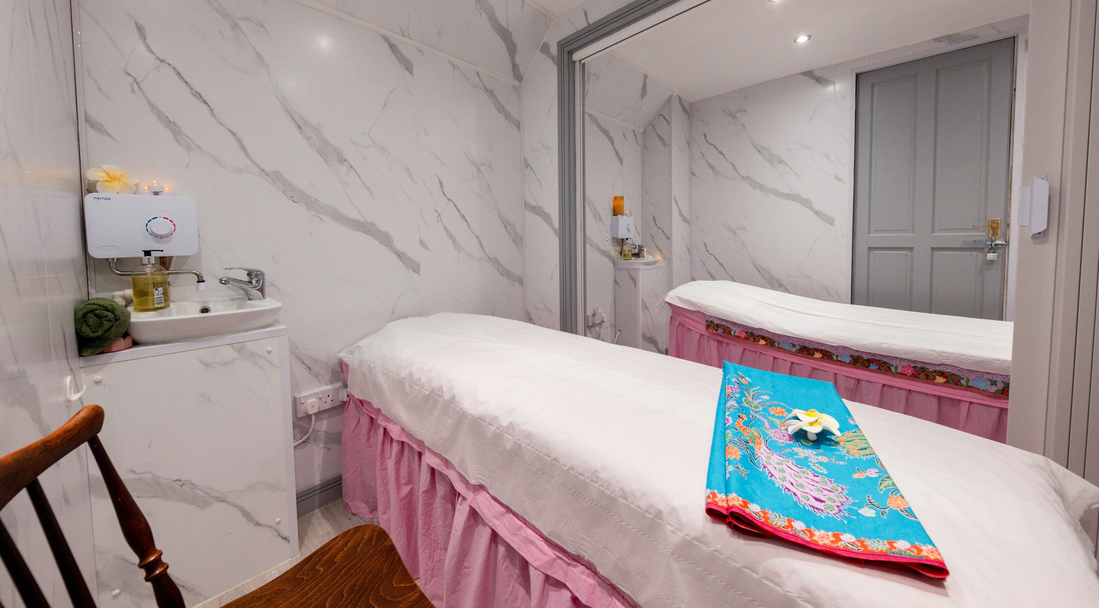 Tranquil massage room at Paanthong Thai Spa, London, England, GB with a calming ambiance.