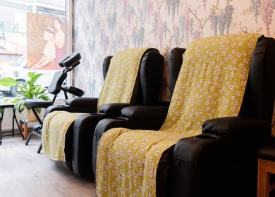 Relaxing seating area at Paanthong Thai Spa in London, England, GB with plush chairs and calming décor.