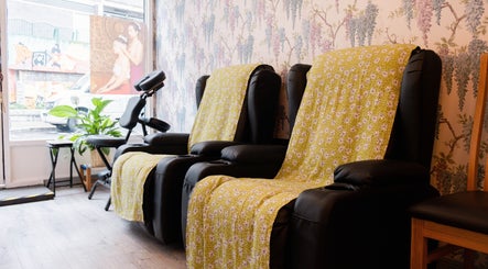 Relaxing seating area at Paanthong Thai Spa in London, England, GB with plush chairs and calming décor.