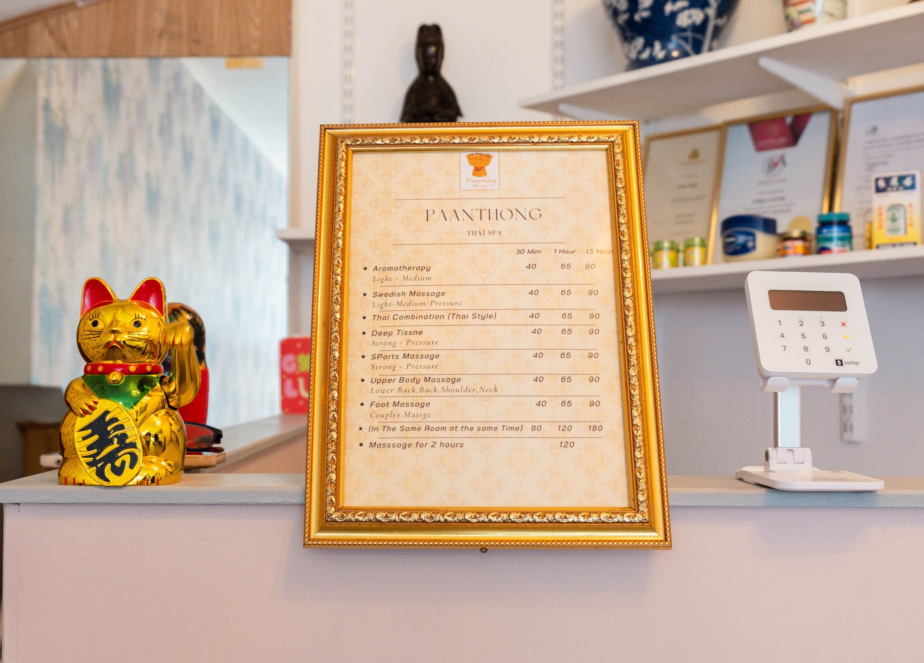 Paanthong Thai Spa menu and decor in London, England, GB, showcasing massage offerings.