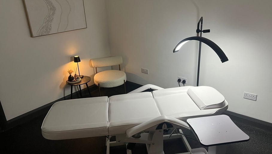 Modern treatment room at Aesthetics By Dr Suchira, Windsor, England, GB with sleek decor and soft lighting.