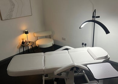 Modern treatment room at Aesthetics By Dr Suchira, Windsor, England, GB with sleek decor and soft lighting.