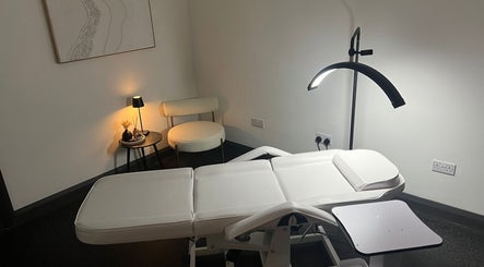 Modern treatment room at Aesthetics By Dr Suchira, Windsor, England, GB with sleek decor and soft lighting.
