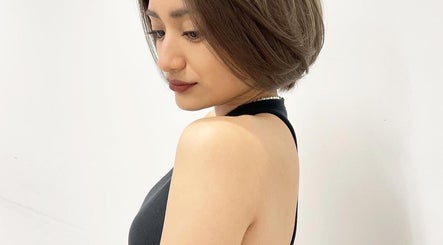 Stylish woman with short hair at Ciel Hair Studio by AKI, Khlong Toei, Bangkok, TH.