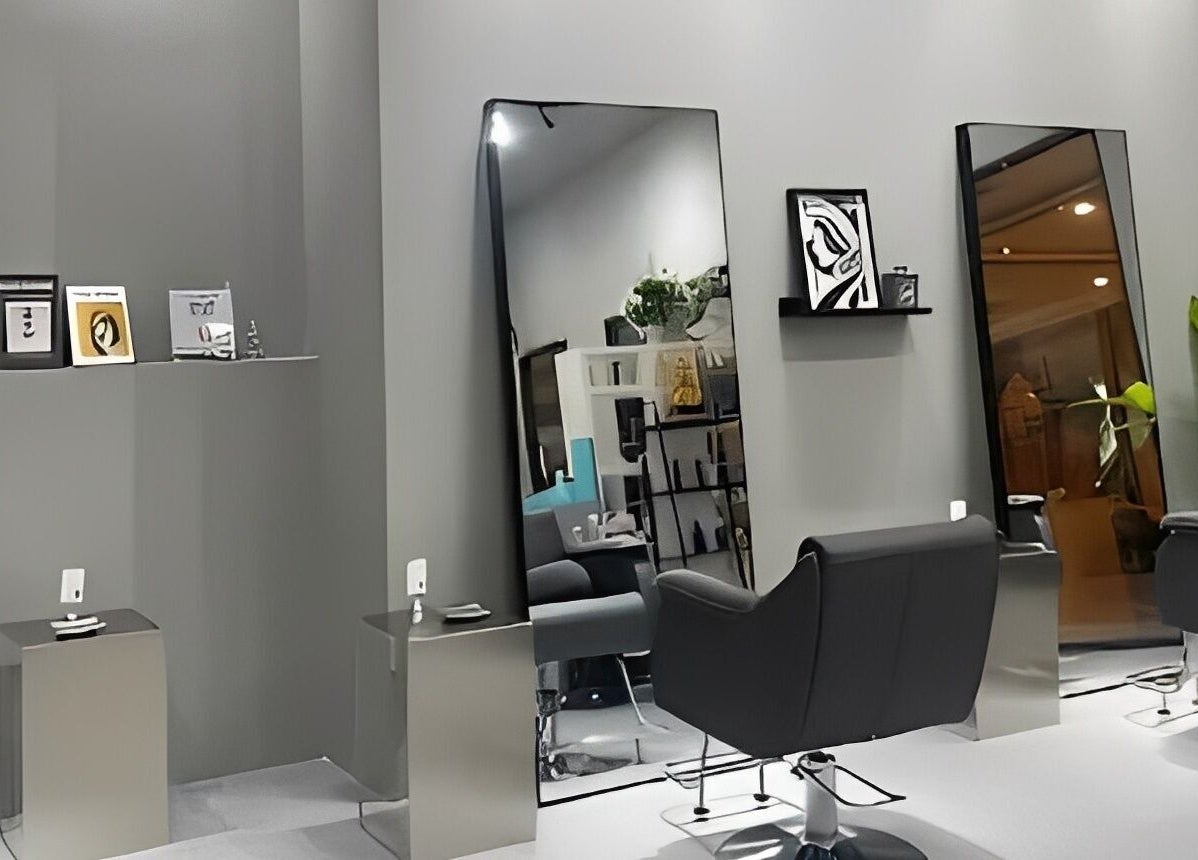 Sleek interior of Ciel Japanese Hair Studio, Khlong Toei, Bangkok, TH with modern styling chairs and large mirrors.