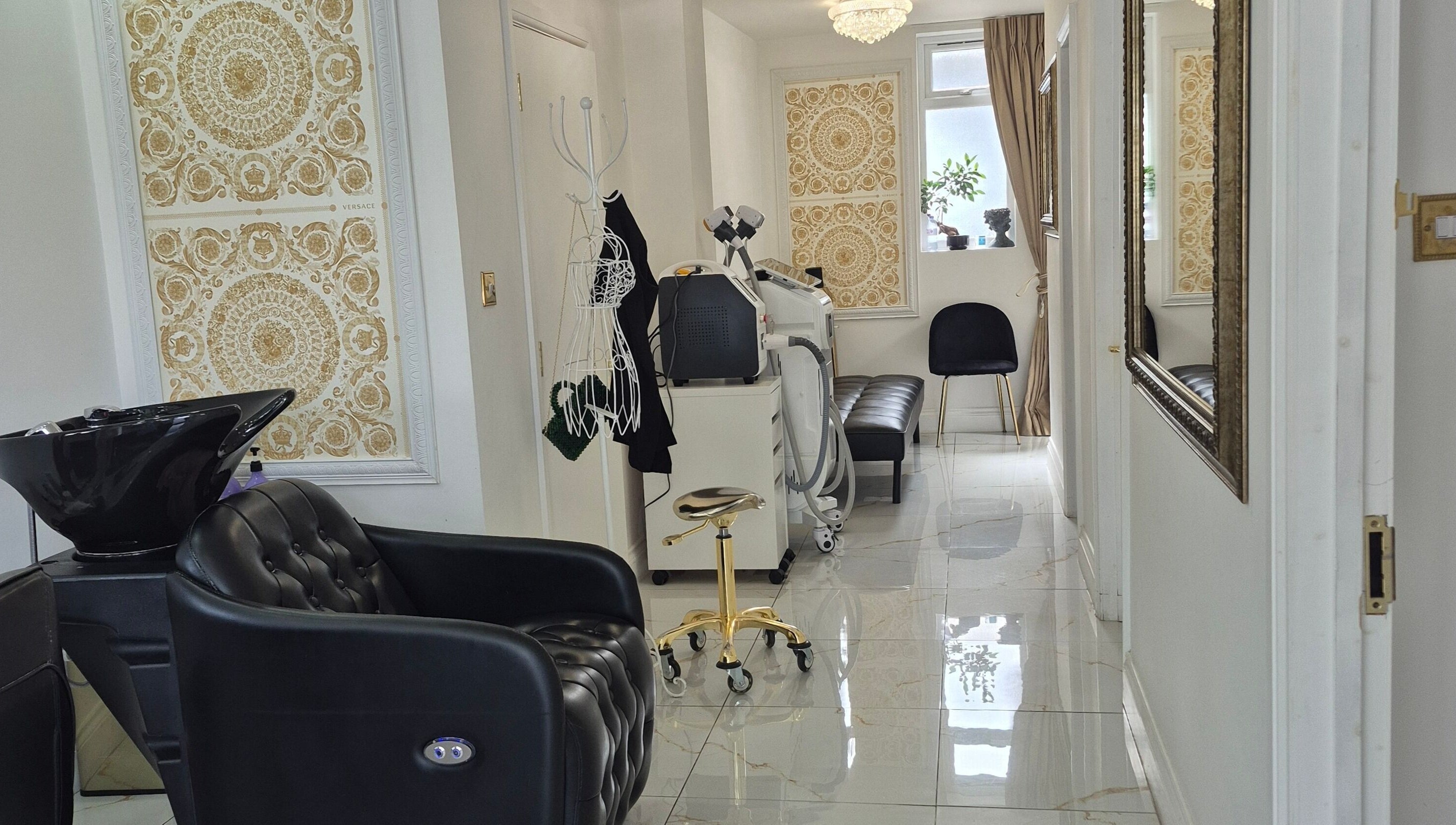 Elegant interior of Just Beauty Salon in Edgware, England, GB showcasing a modern styling chair and equipment.