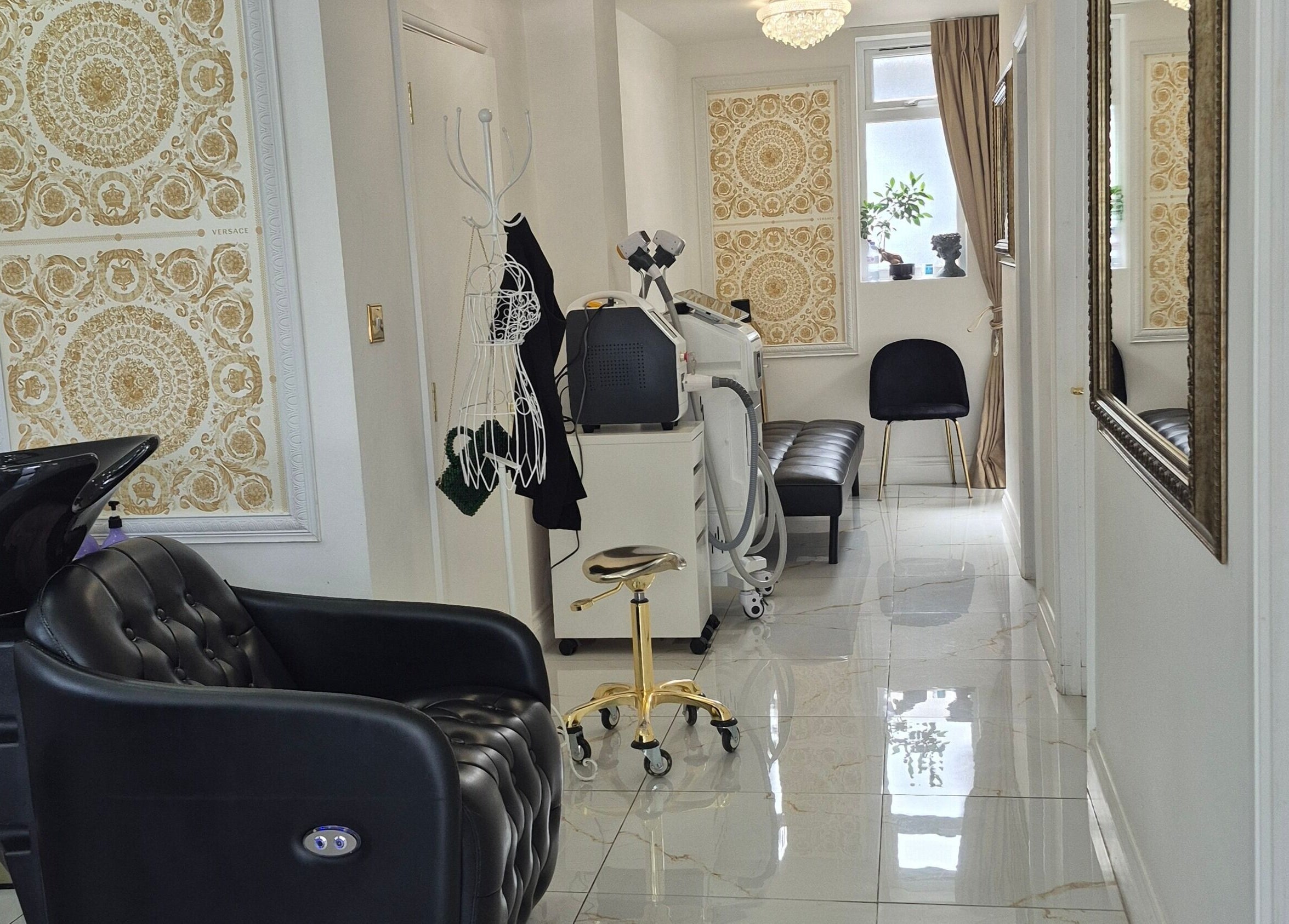 Elegant interior of Just Beauty Salon in Edgware, England, GB showcasing a modern styling chair and equipment.