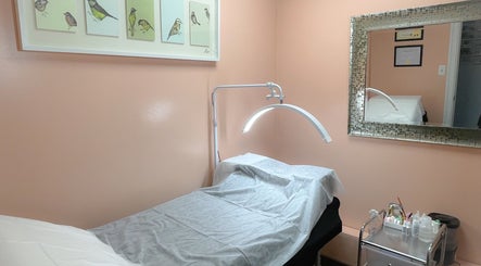 Relaxing treatment room at A Studio, West Babylon, New York, US with calming decor and mirror detail.
